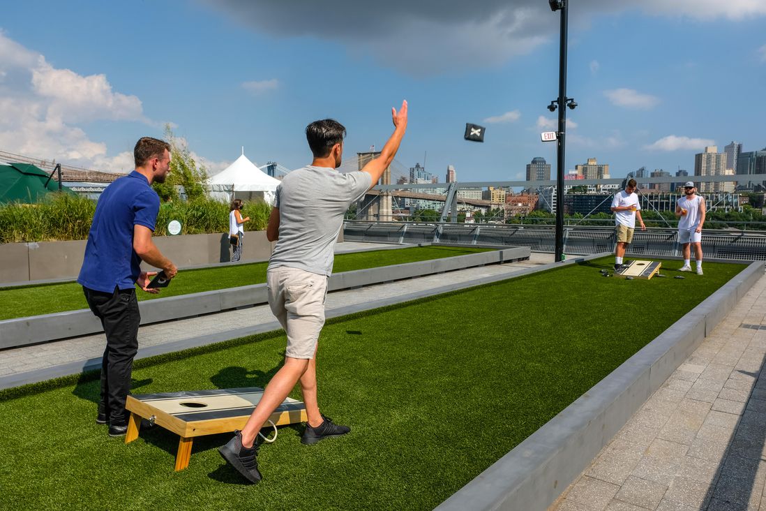 Cornhole on the rooftop of Pier 17's mall